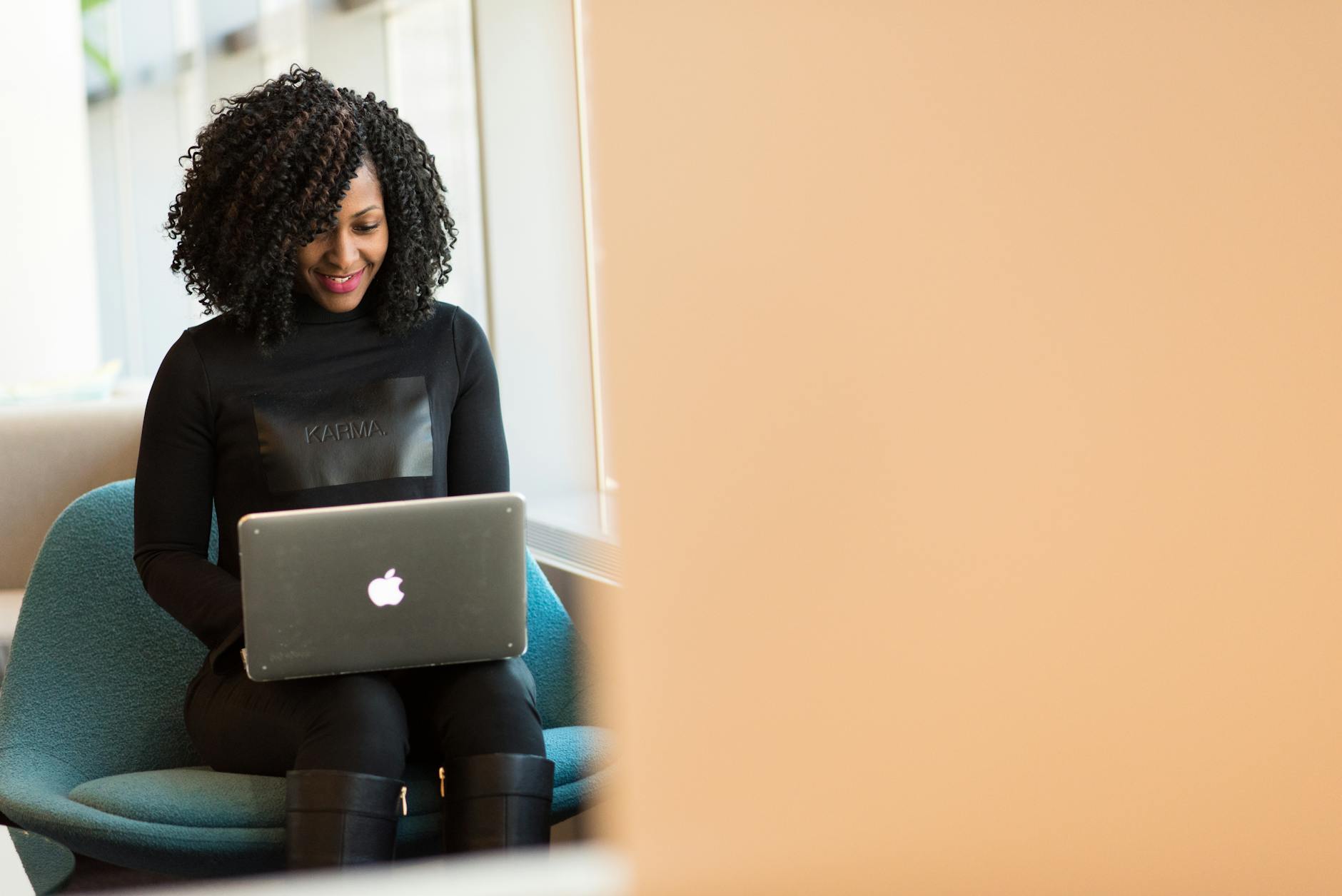 woman holding macbook