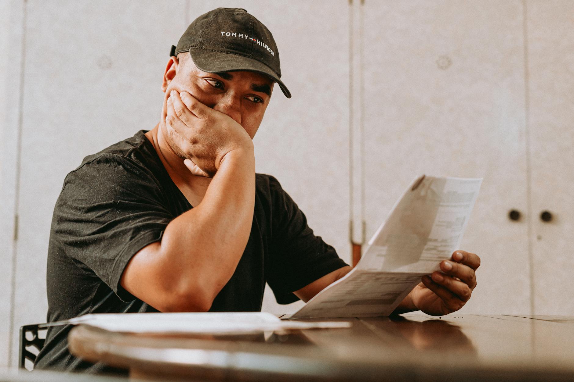 worried father looking on child school grades