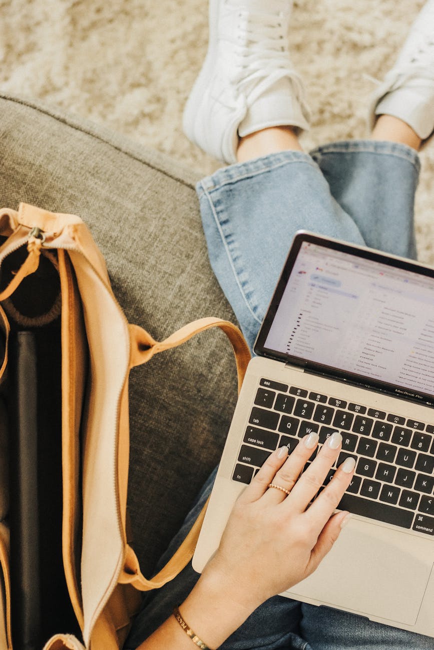 casual workspace with laptop and tote bag