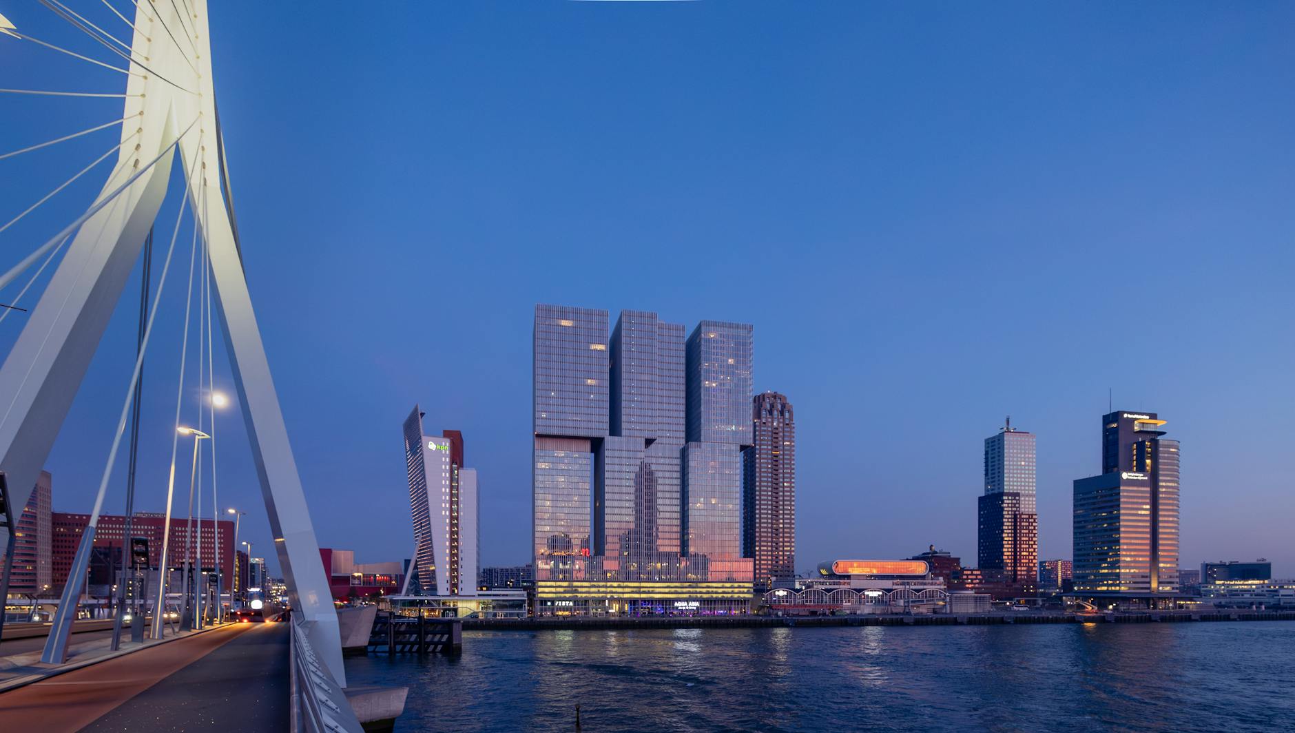 erasmus bridge overlooking rotterdam cityscape at dusk