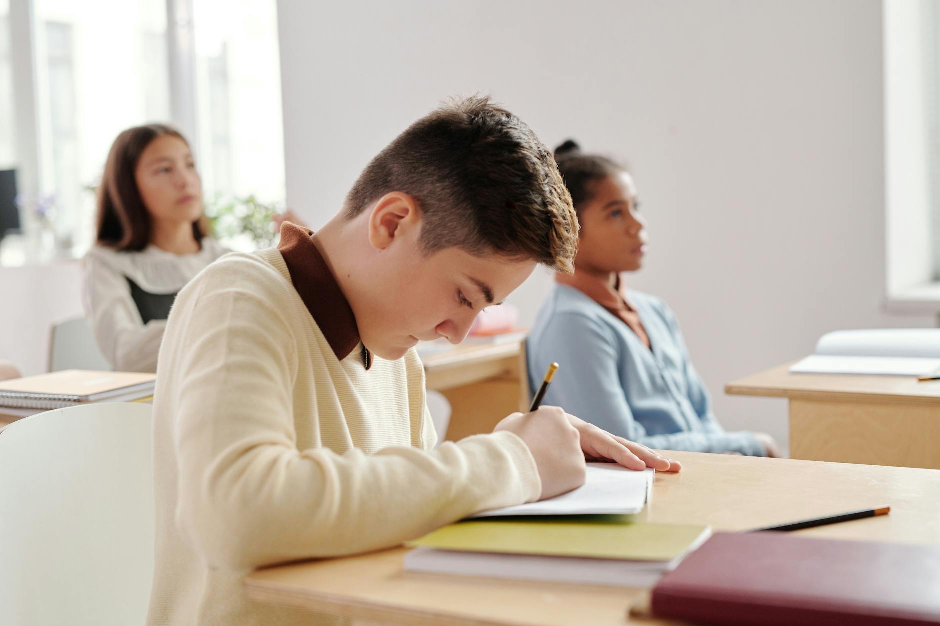 student writing in the notebook