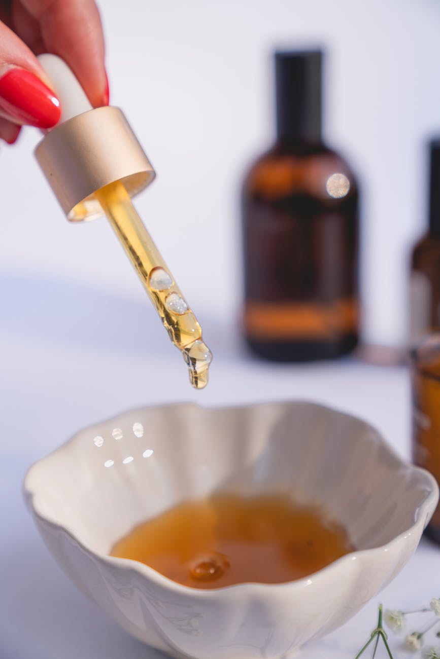 a close up shot of a person using a dropper