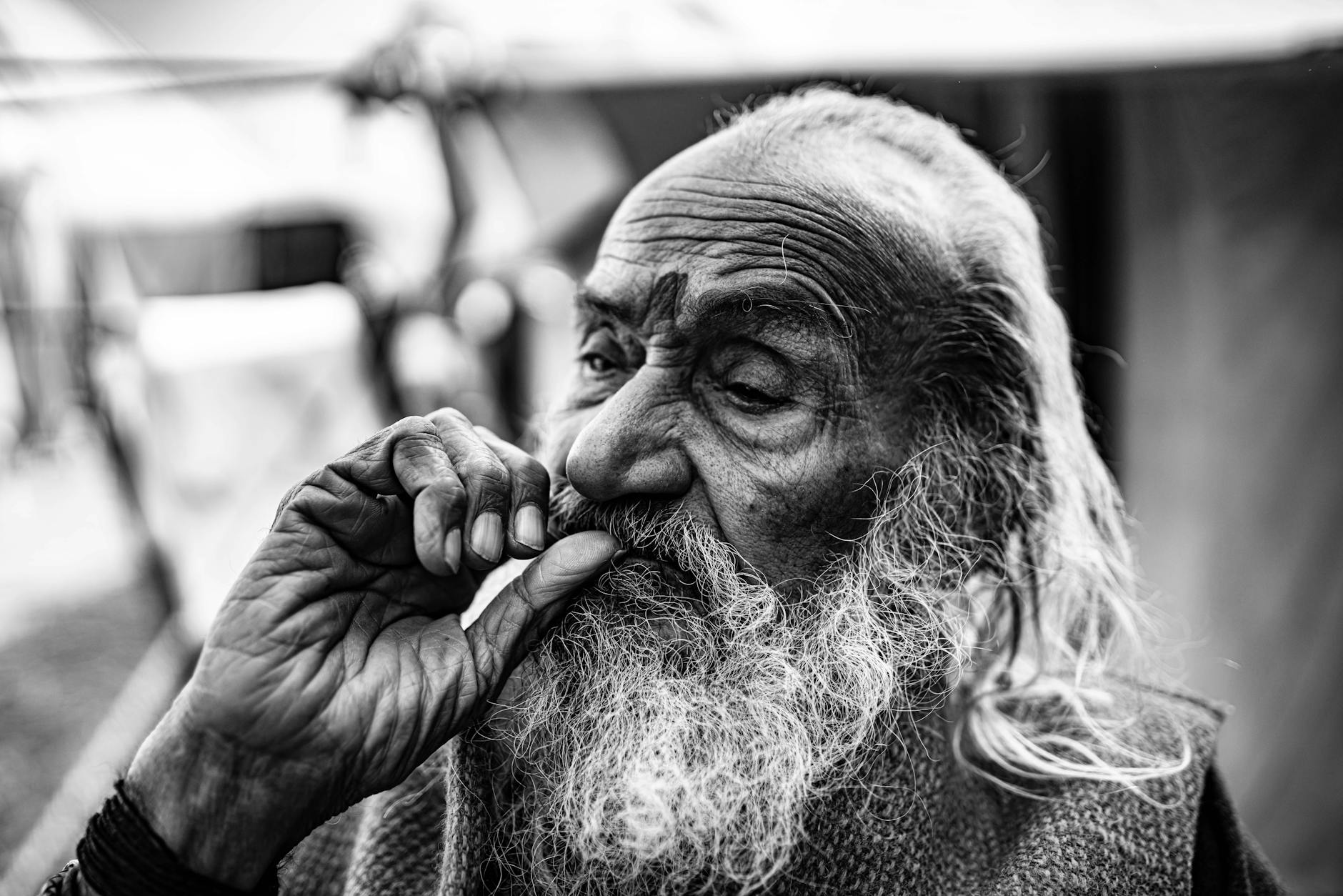 expressive portrait of an elderly man in black and white