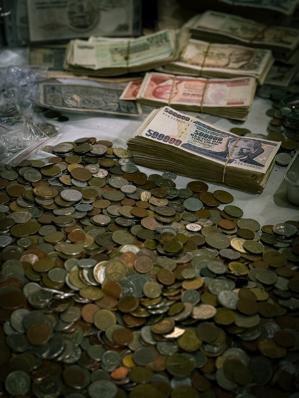 coins and stacks of vintage currency notes