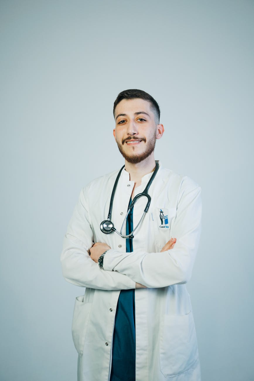 confident young doctor with stethoscope portrait