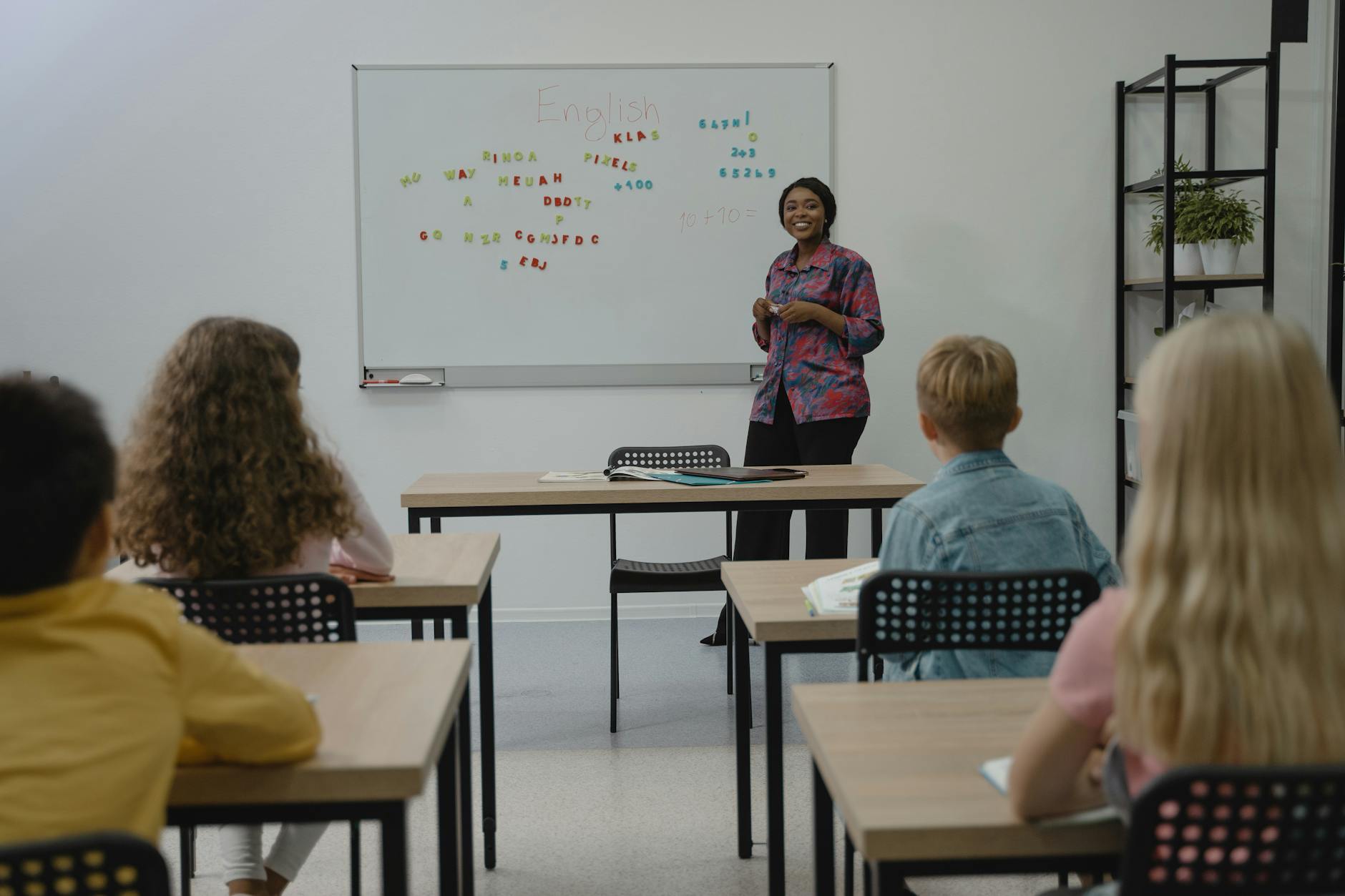 teacher smiling at her students