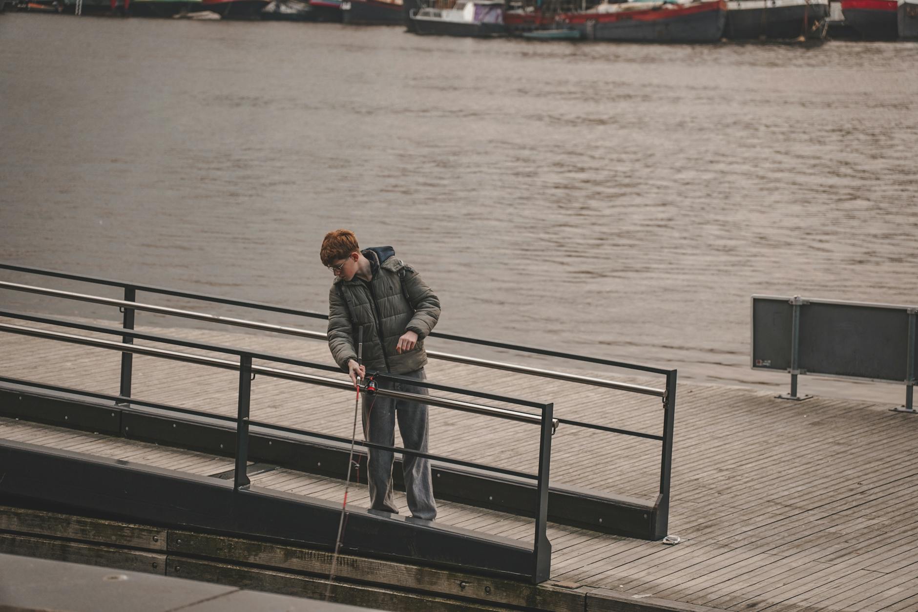casual urban scene with man by waterfront