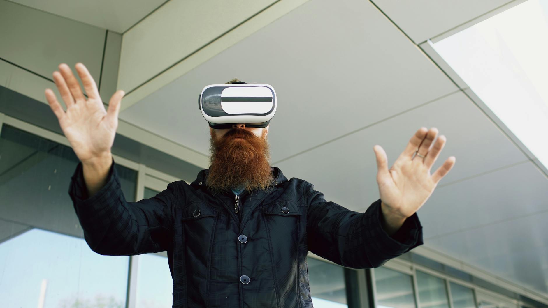 bearded man exploring virtual reality outdoors