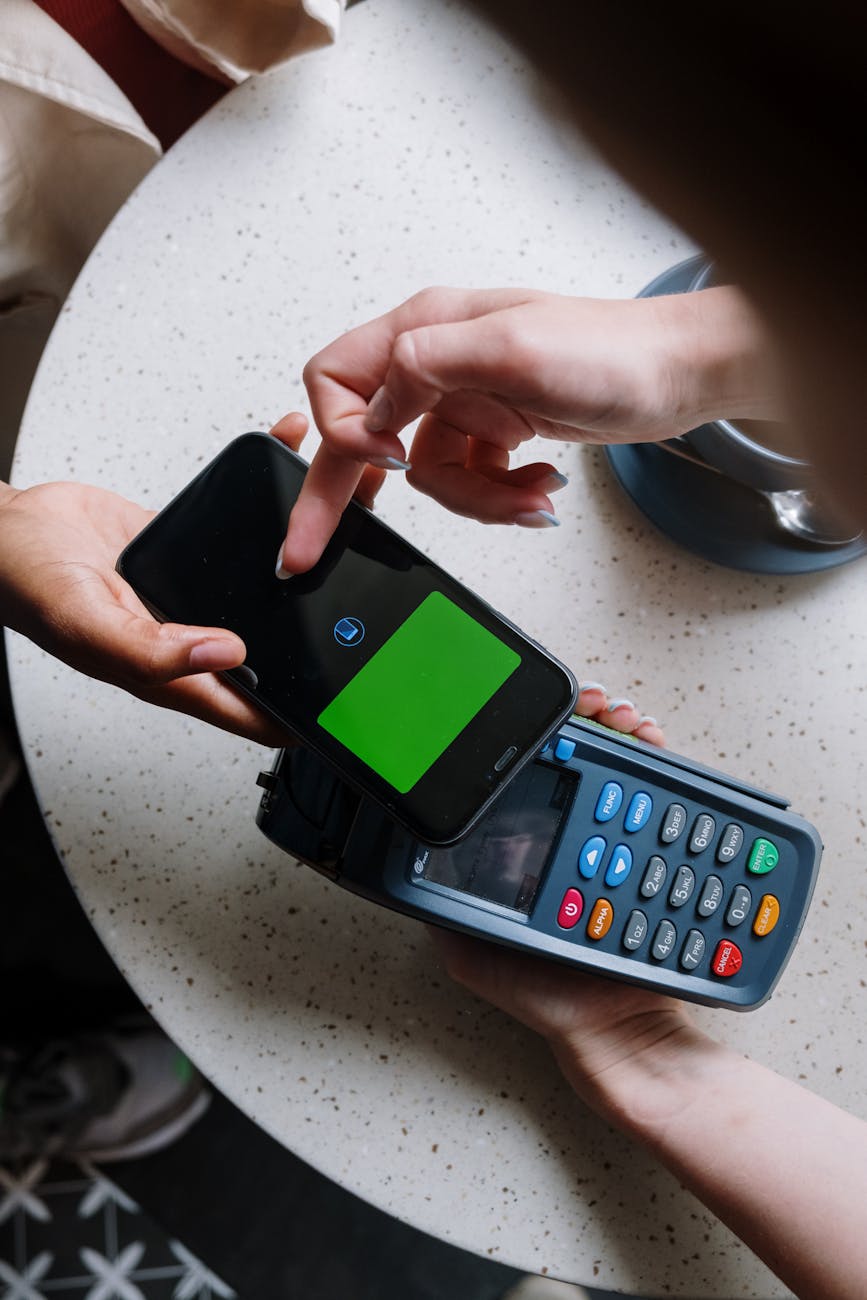 black and green calculator on white table
