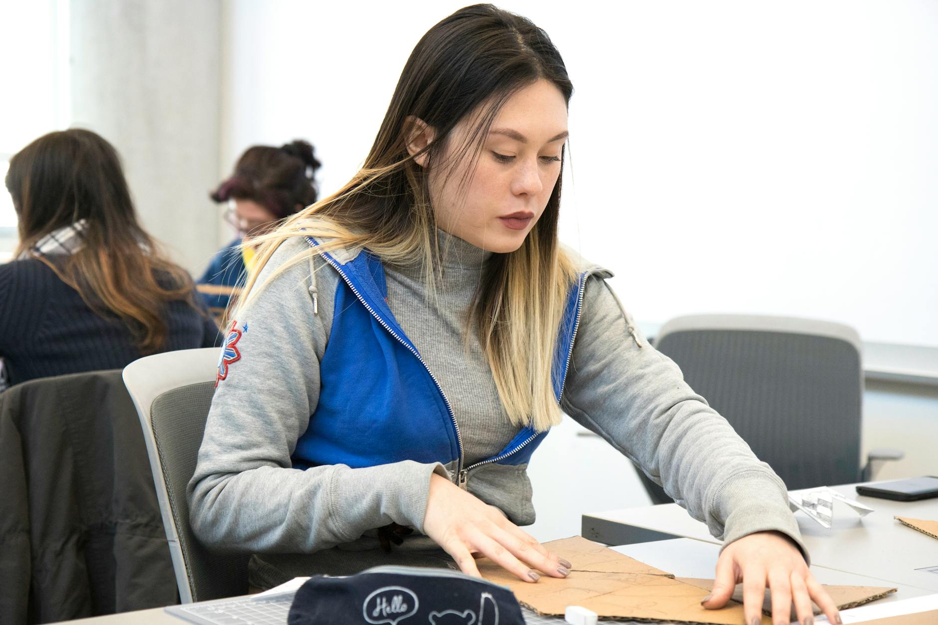 a female student sitting on a chair
