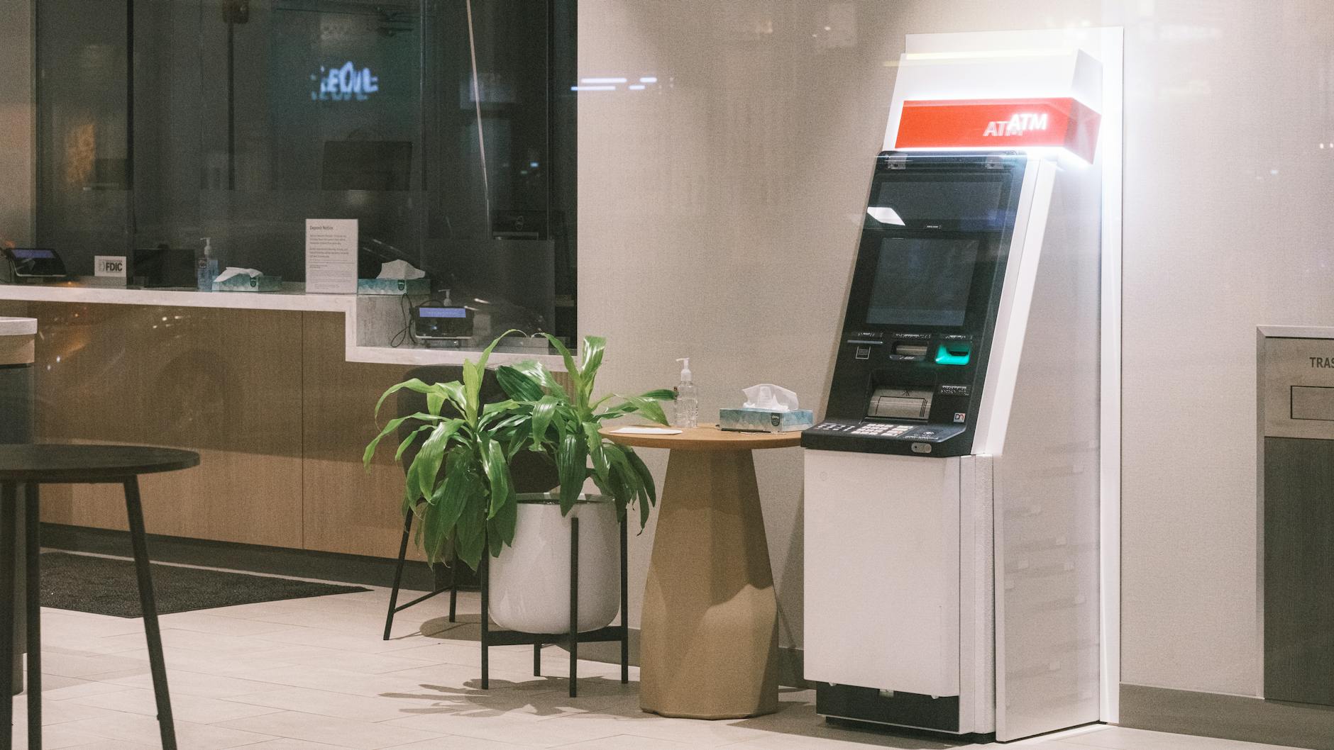 modern atm machine in quiet bank lobby