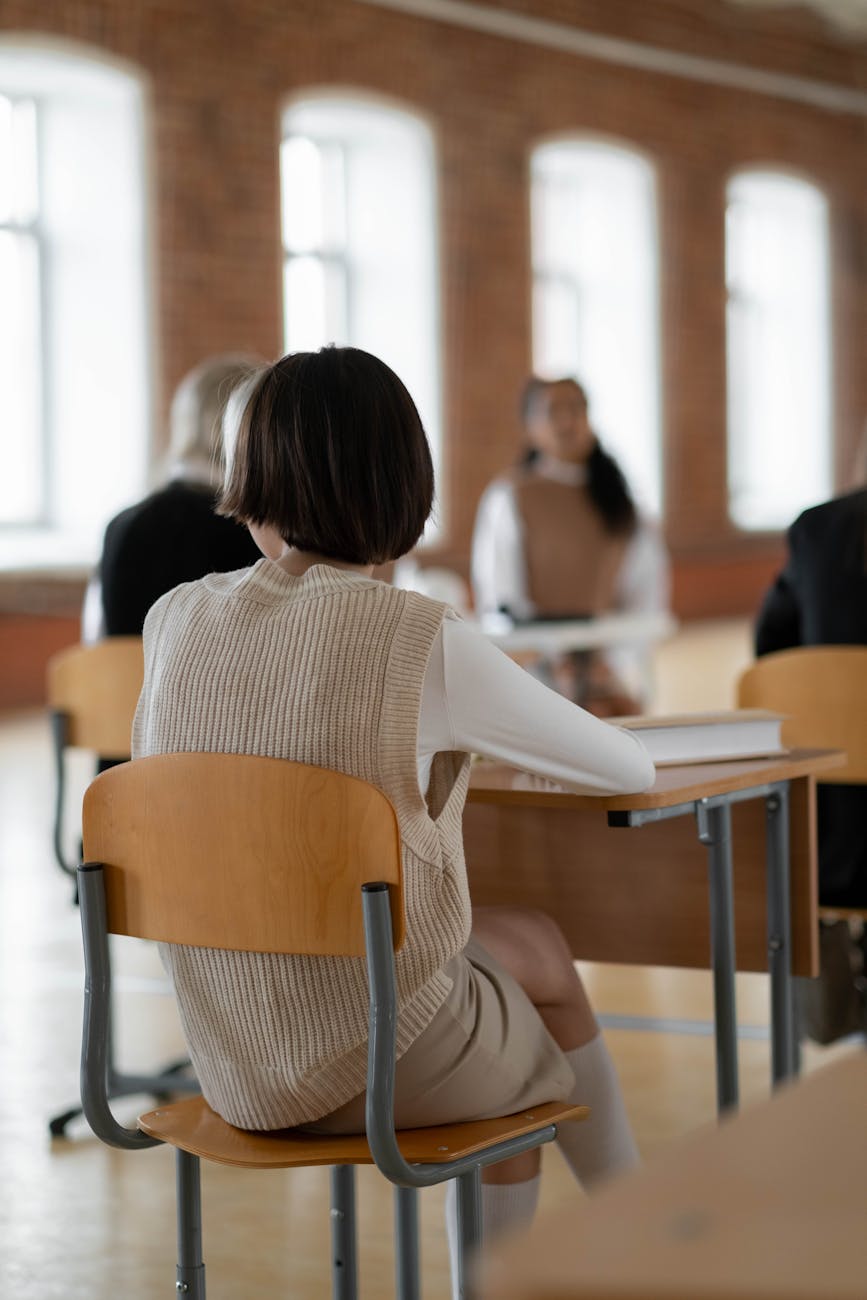 a girl sitting at the table