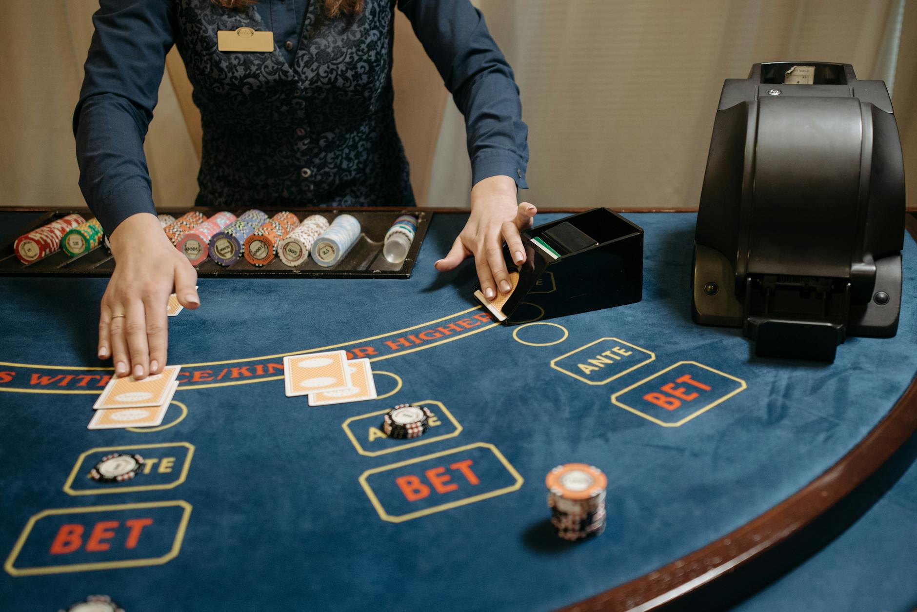 a dealer holding playing cards