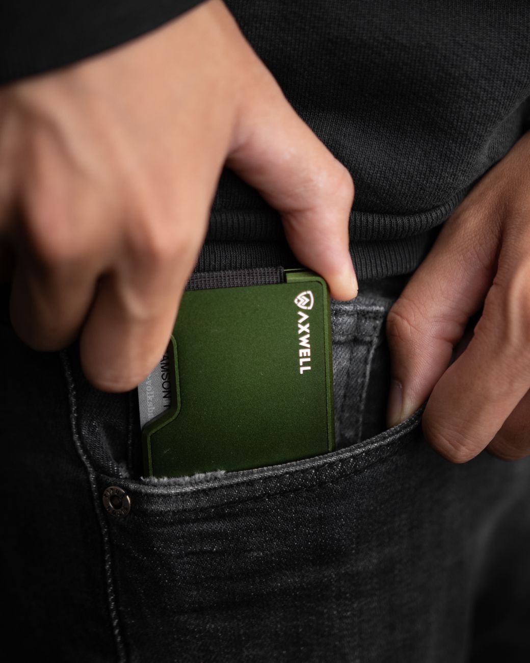 close up shot of a person holding a metal wallet
