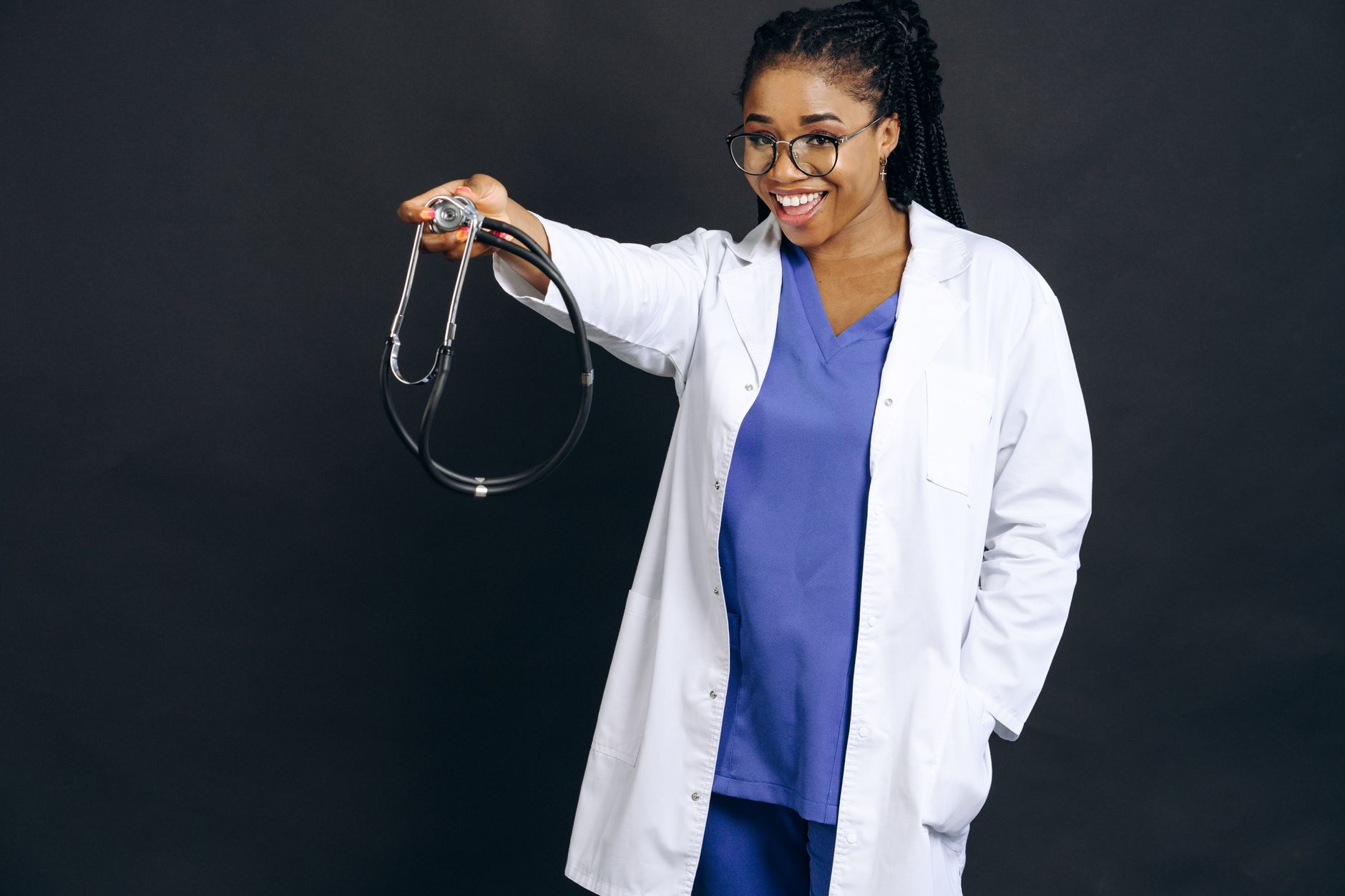 smiling doctor holding stethoscope