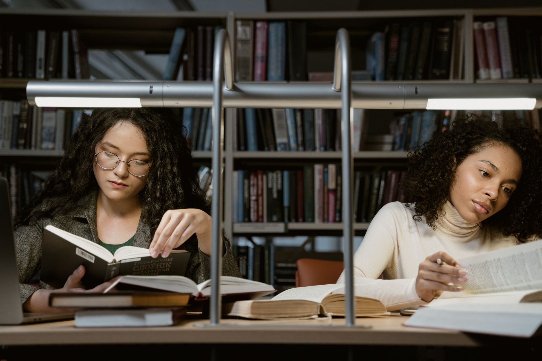 women reading books in a library