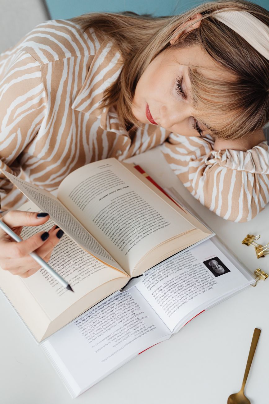 a woman reading books