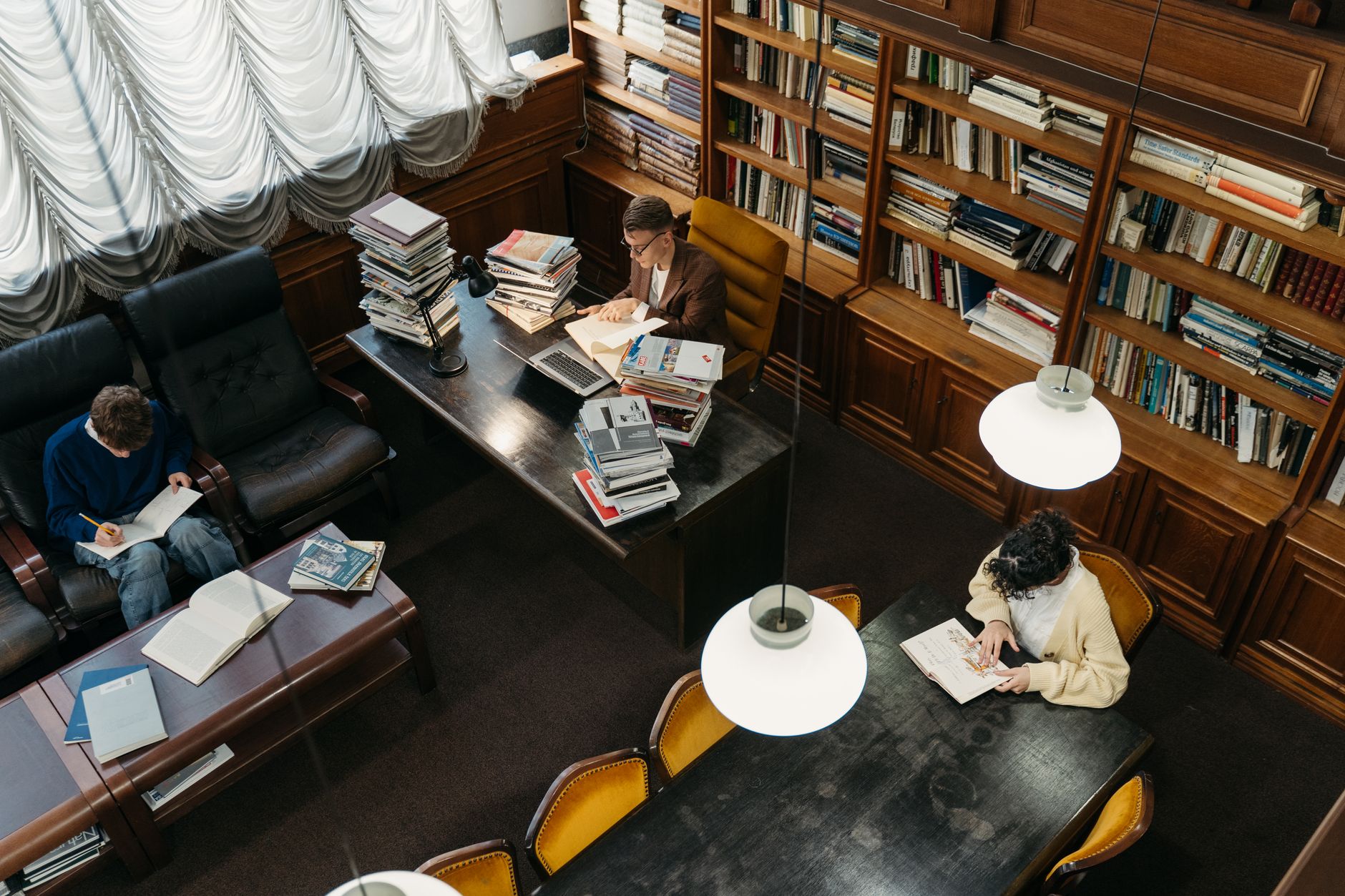 people reading inside a library