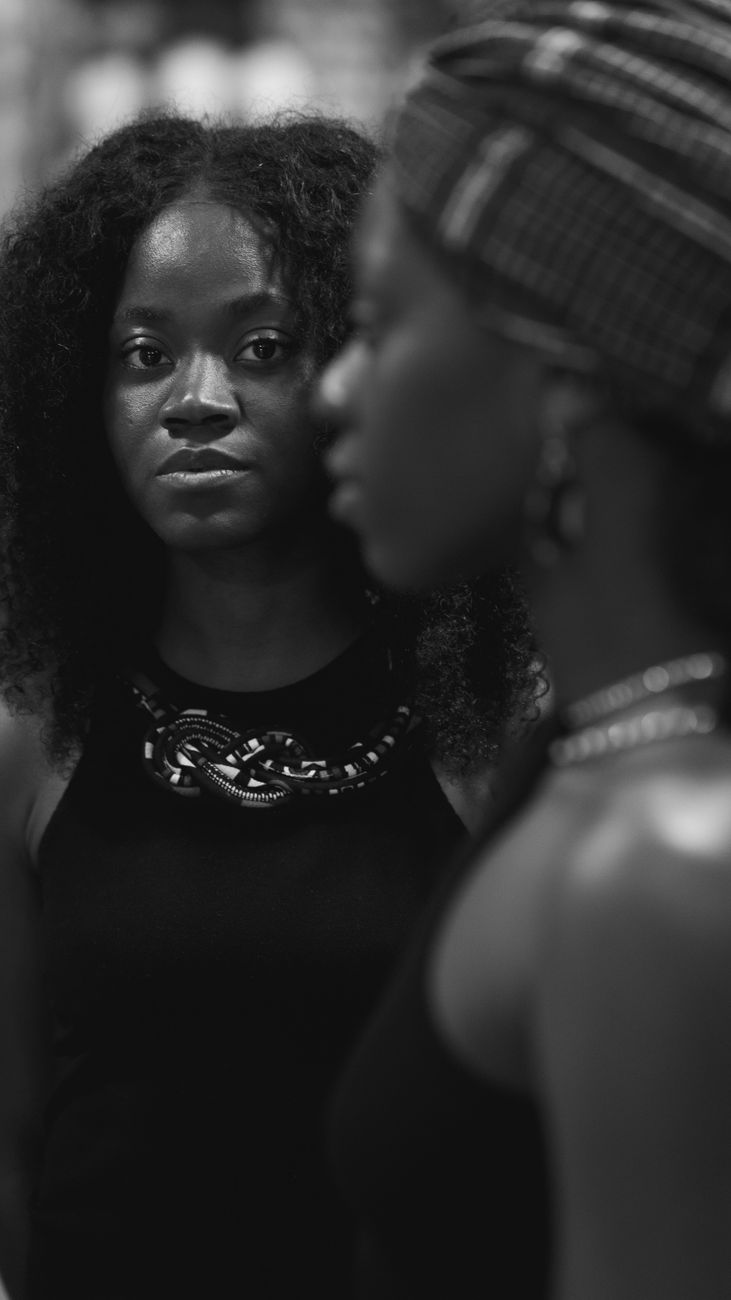pensive woman looking at other woman