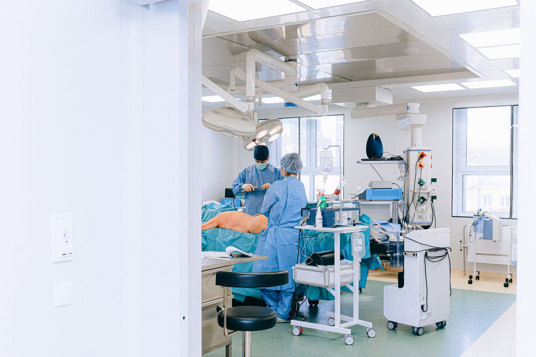doctor and nurse with patient in examination room