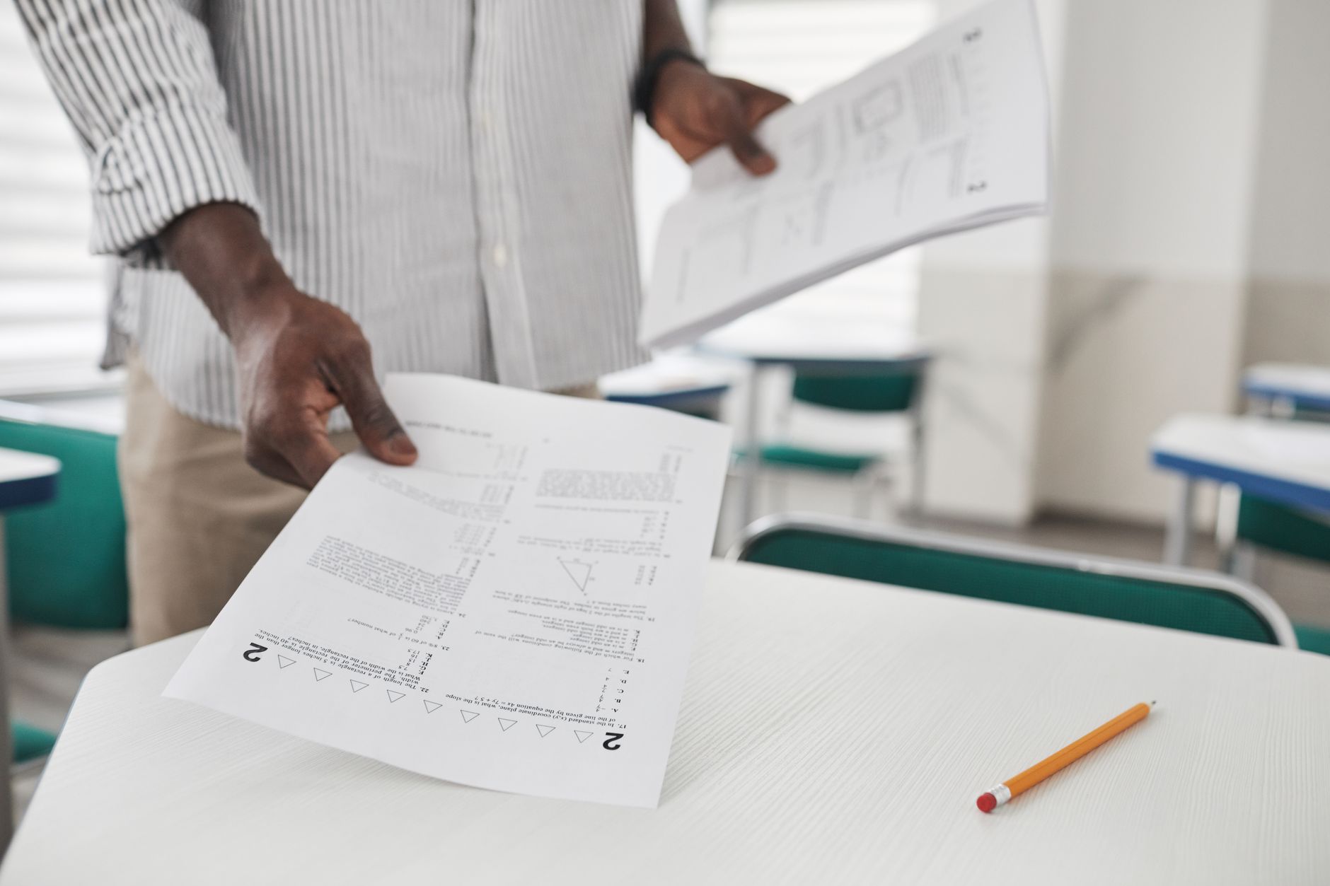 a person holding test papers