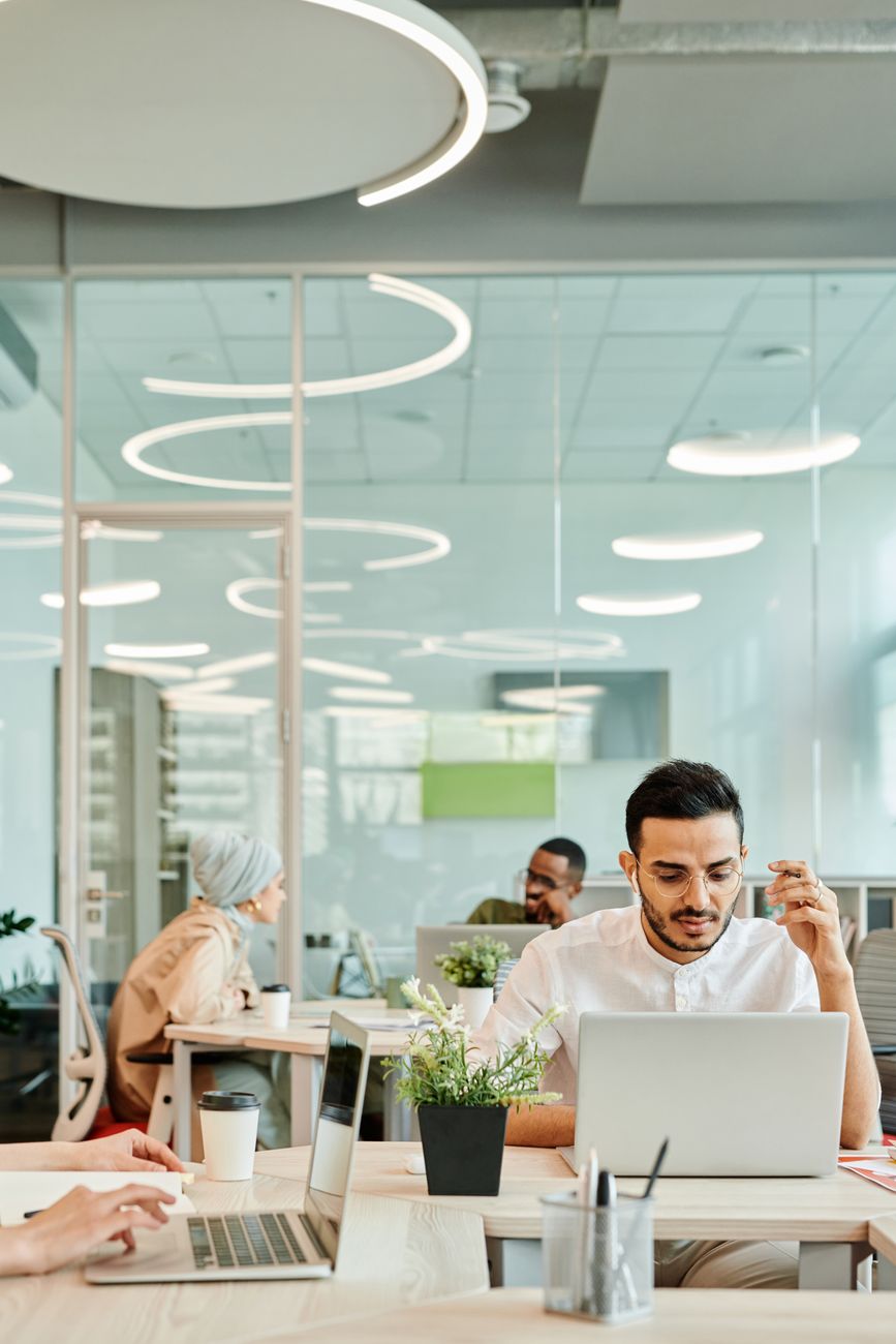 man using a laptop at the office