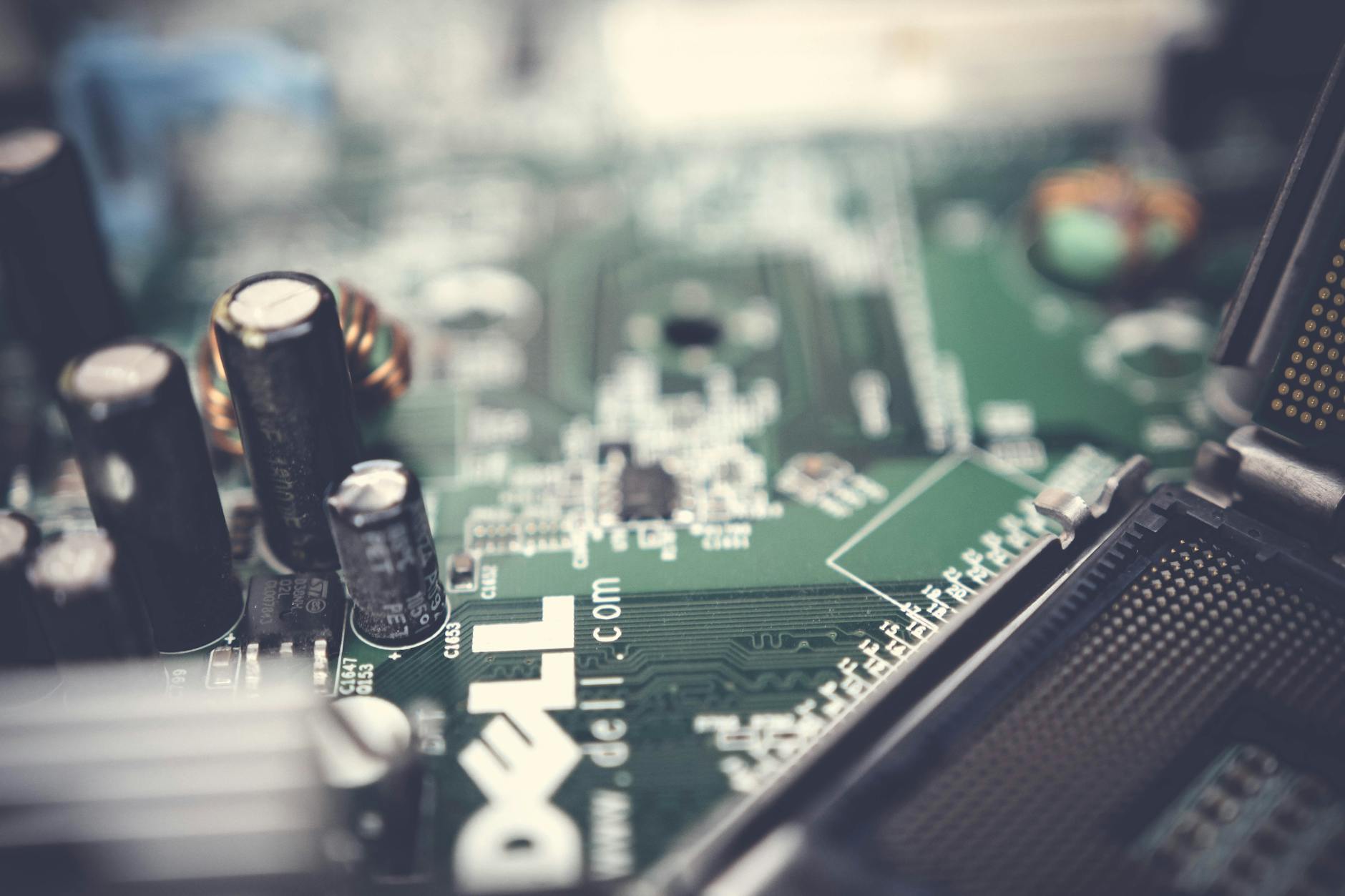 closed up photo of green dell circuit board