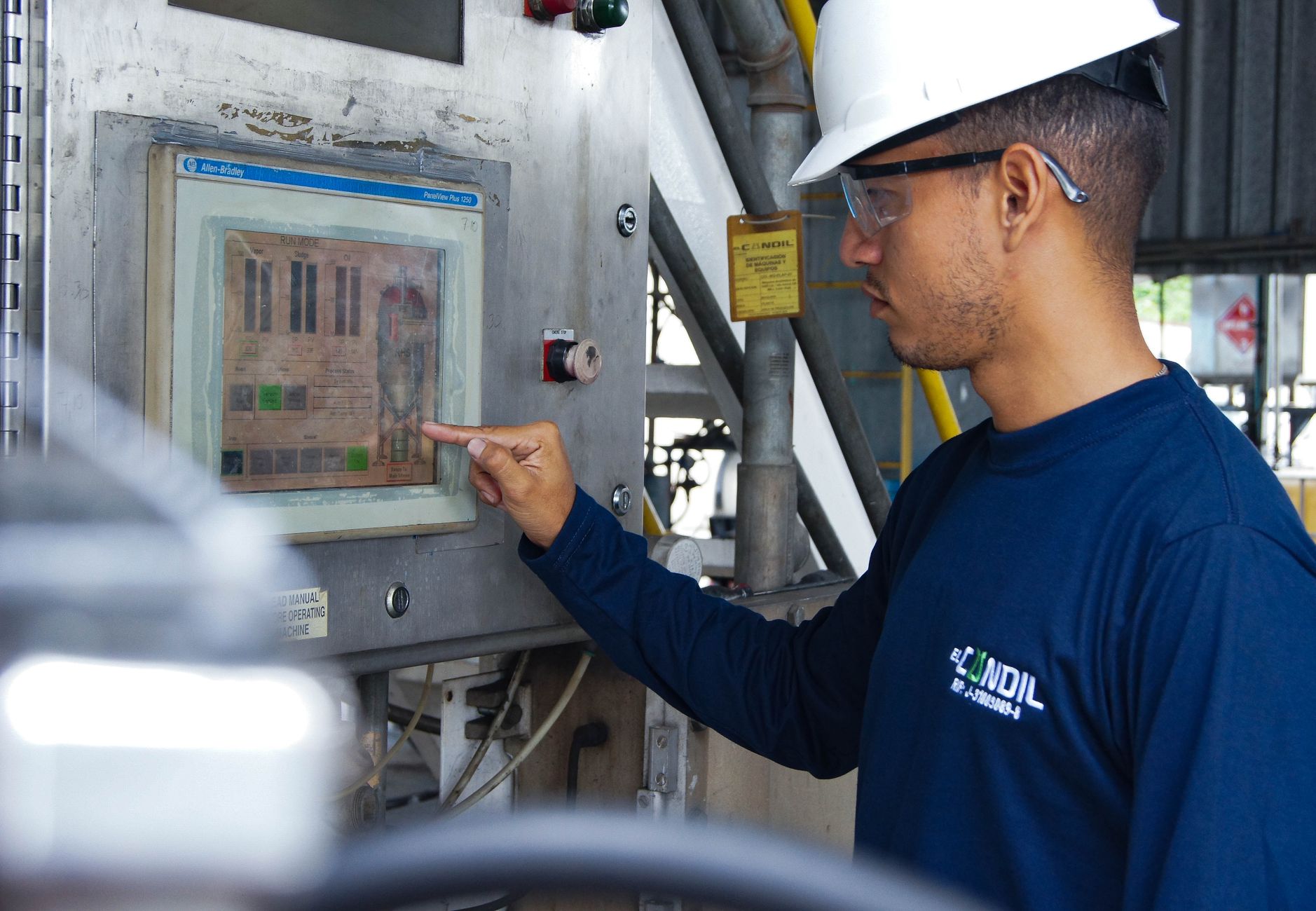 industrial worker operating control panel