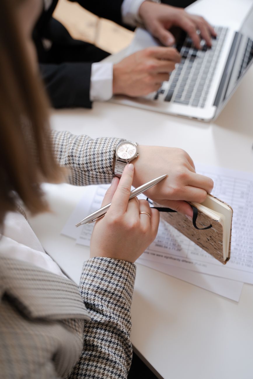 a woman looking at her wristwatch