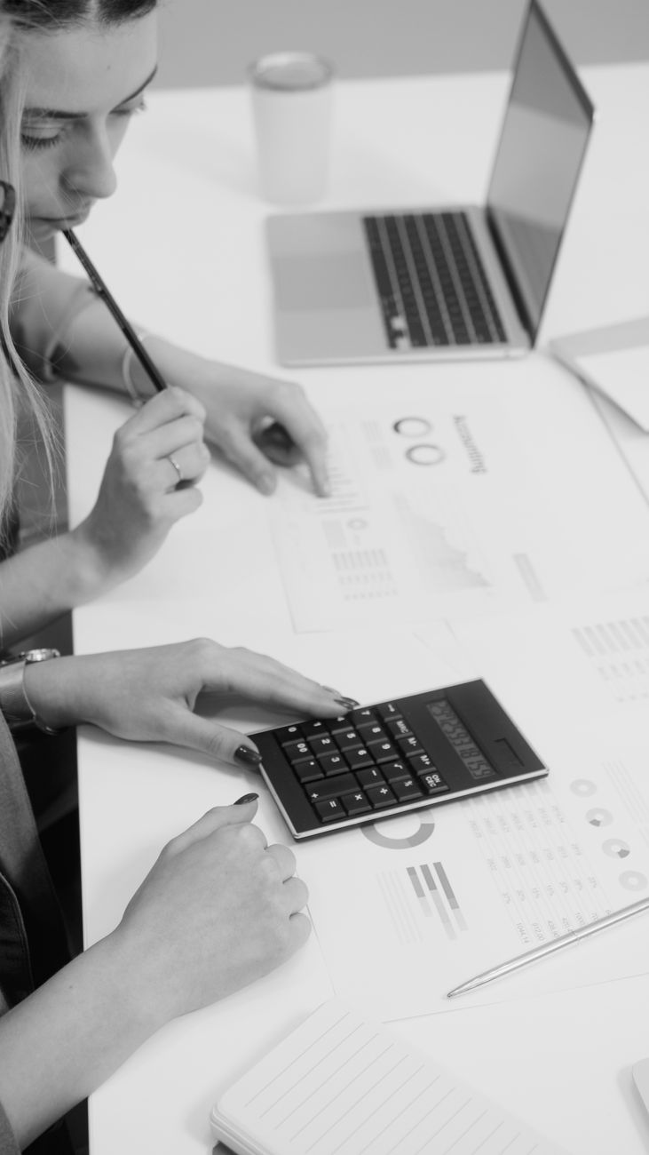 colleagues computing using a calculator