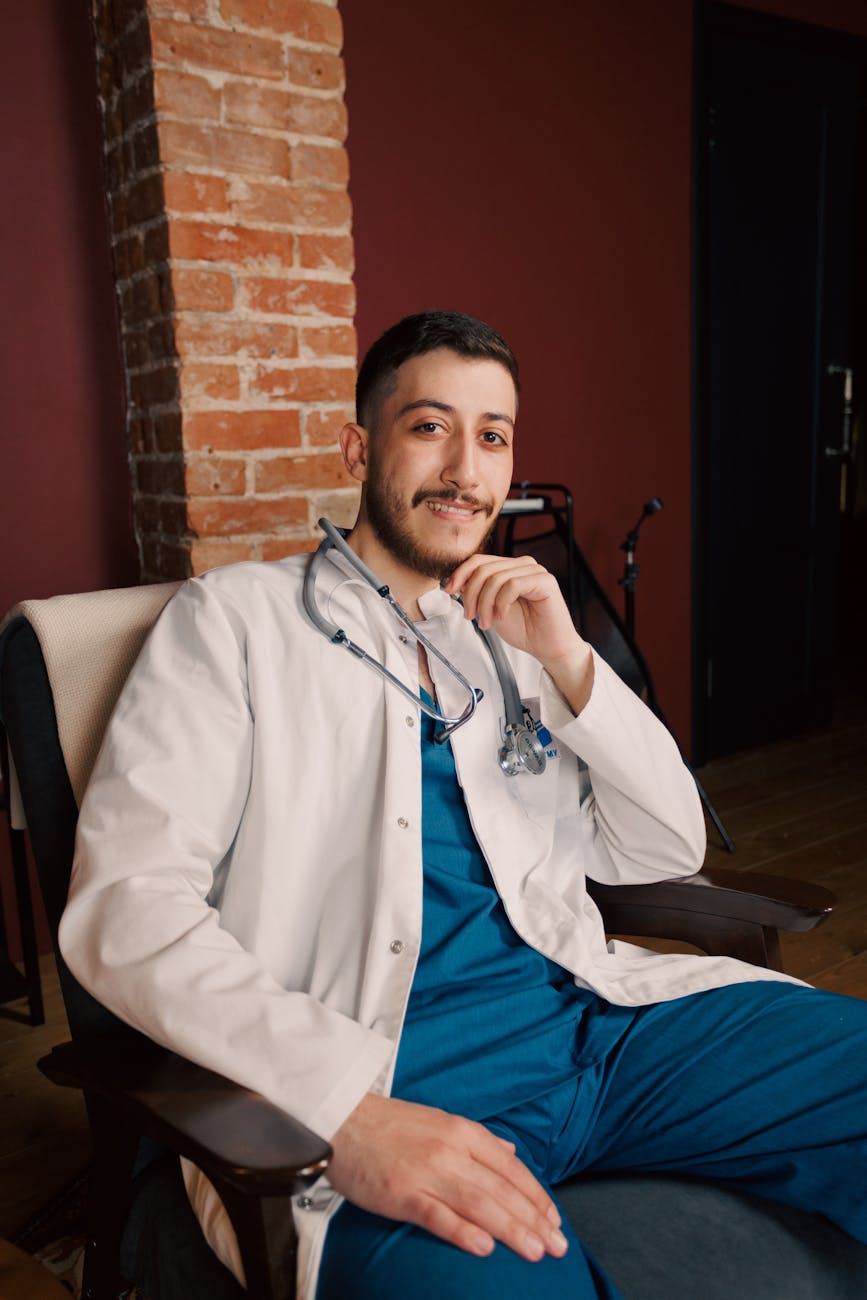 smiling male doctor in modern clinic setting