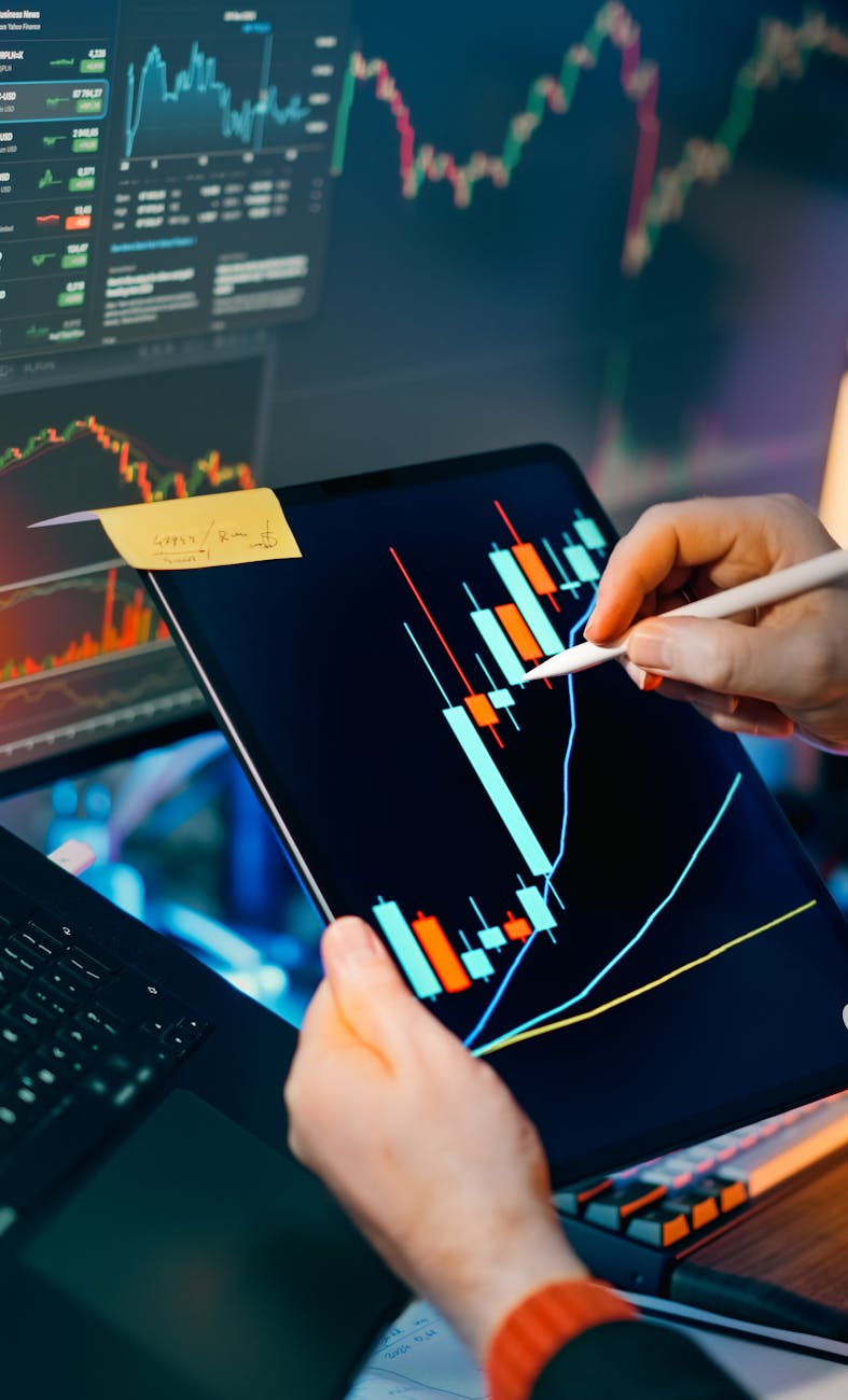 analyzing financial charts on tablet for market insights