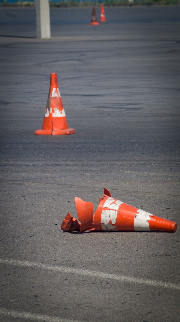 orange traffic cones on a parking lot